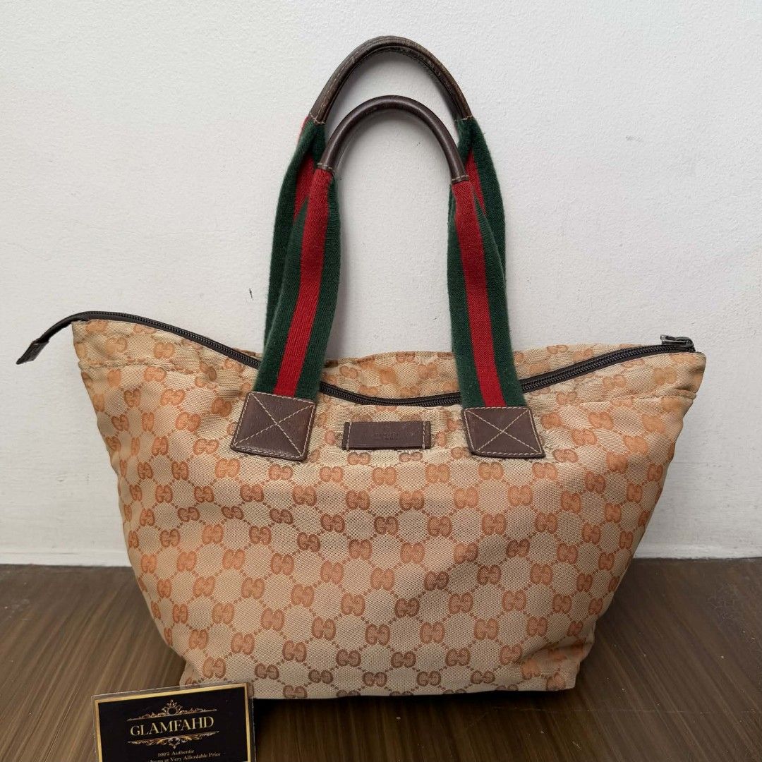 Pre Owned Authentic GUCCI GG Canvas Sherryline Bag (Category: Luxury Bags & Wallets) located in Paranaque City. Submitted by Glamfahd (Listing ID 1429348765, Image 1). Description: Pre Owned Authentic GUCCI GG Bag Inclusion/s: None Condition Well Used condition Marks on exterior Marks on interior Missing zipper puller Bag is really a great buy! Please manage your expectations as you are buying an authentic second hand item at a fraction of the co