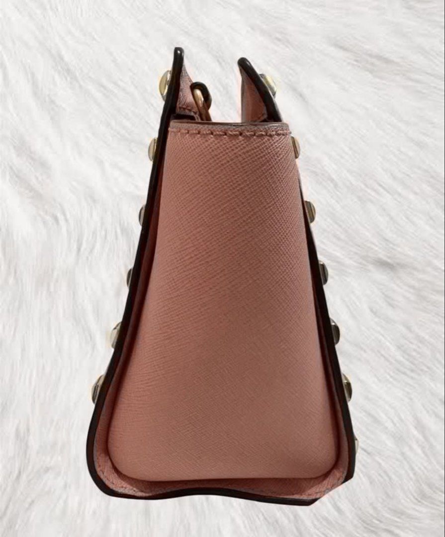 Preloved Michael Kors Studded Crossbody Bag (Category: Luxury Bags & Wallets) located in Manila. Submitted by JAngel (Listing ID 1429446983, Image 3). Description: Michael Kors crossbody bag features a blush pink color with gold-tone hardware. It has a studded design and comes with a detachable strap. The interior has a zip pocket and the Michael Kors logo lining..