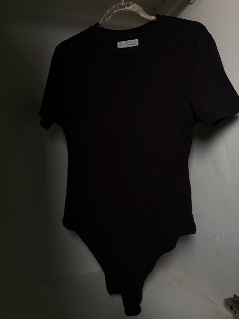 Primark Black Bodysuit - Size M (Category: Others Tops) located in Pulilan. Submitted by margaretsedit (Listing ID 1429415640, Image 1). Description: Black bodysuit. Features a round neckline and short sleeves. The size is M. Made in Bangladesh. The bodysuit is a solid black color. Perfect for layering or wearing on its own. Add 62 for SF.