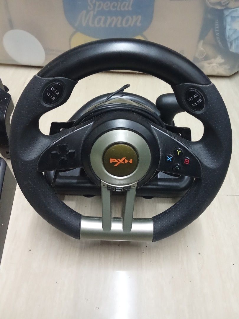 PXN V3 Pro Steering Wheel (Category: Controllers) located in Bacoor. Submitted by francisnuts (Listing ID 1429451761, Image 2). Description: Lightly Used, Works and Functions Correctly RFS - Barely Used.