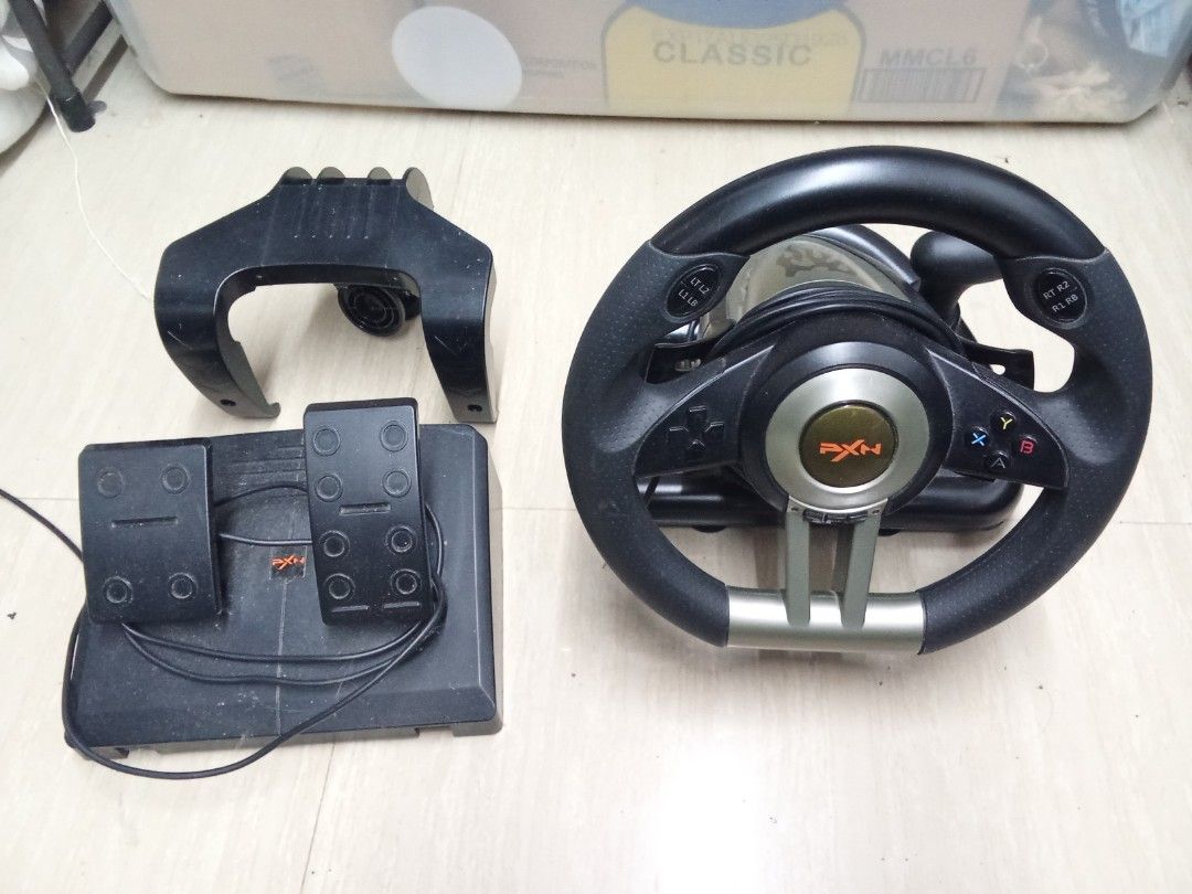 PXN V3 Pro Steering Wheel (Category: Controllers) located in Bacoor. Submitted by francisnuts (Listing ID 1429451761, Image 1). Description: Lightly Used, Works and Functions Correctly RFS - Barely Used.