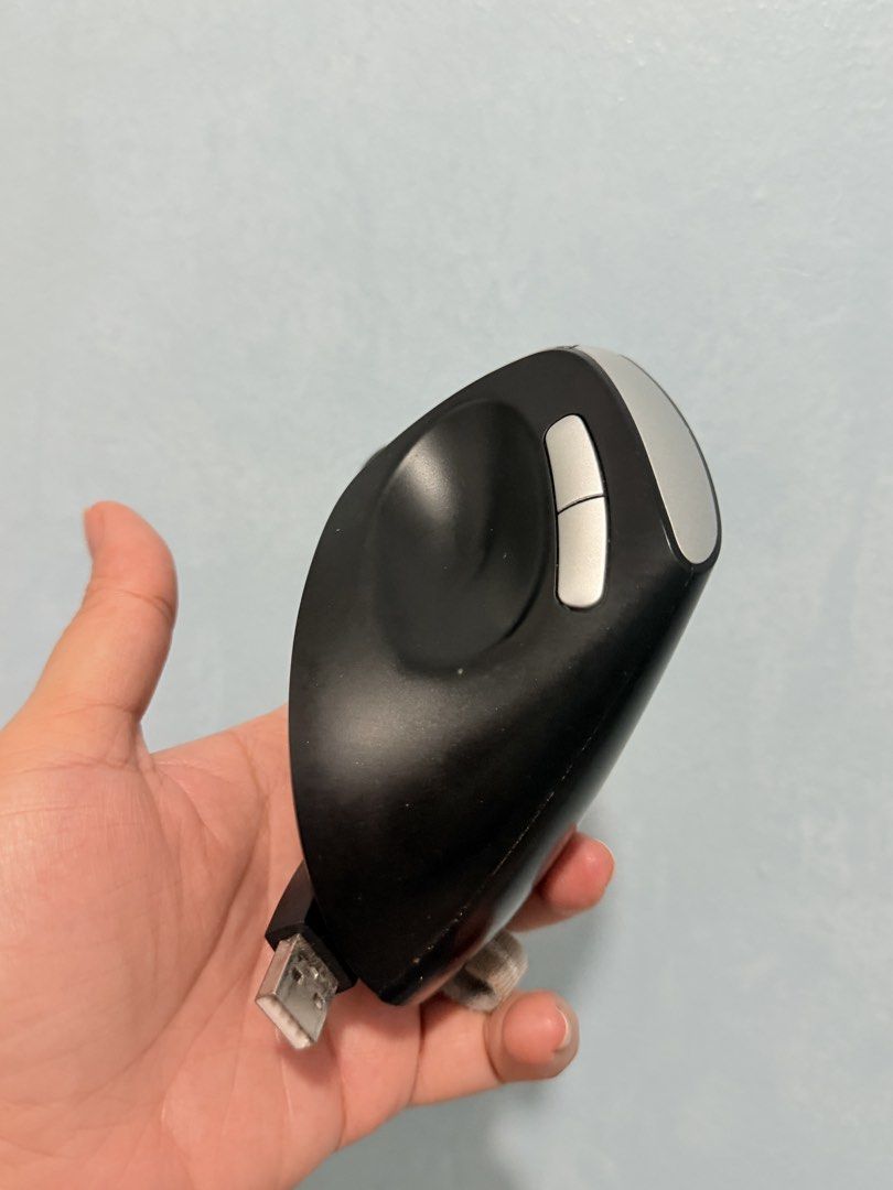 Rapoo EV250 Silent Wireless Ergonomic Optical Mouse (Category: Mouse & Mousepads) located in Taguig. Submitted by ellasee (Listing ID 1429468475, Image 3). Description: Rapoo EV250 is a silent wireless ergonomic optical mouse. It features adjustable 1600 DPI, 2.4GHz wireless connectivity, and a 60-degree vertical angle. It has a triangle design and a 10m wireless distance. The mouse is compatible with both Apple and Windows devices. It has a USB 