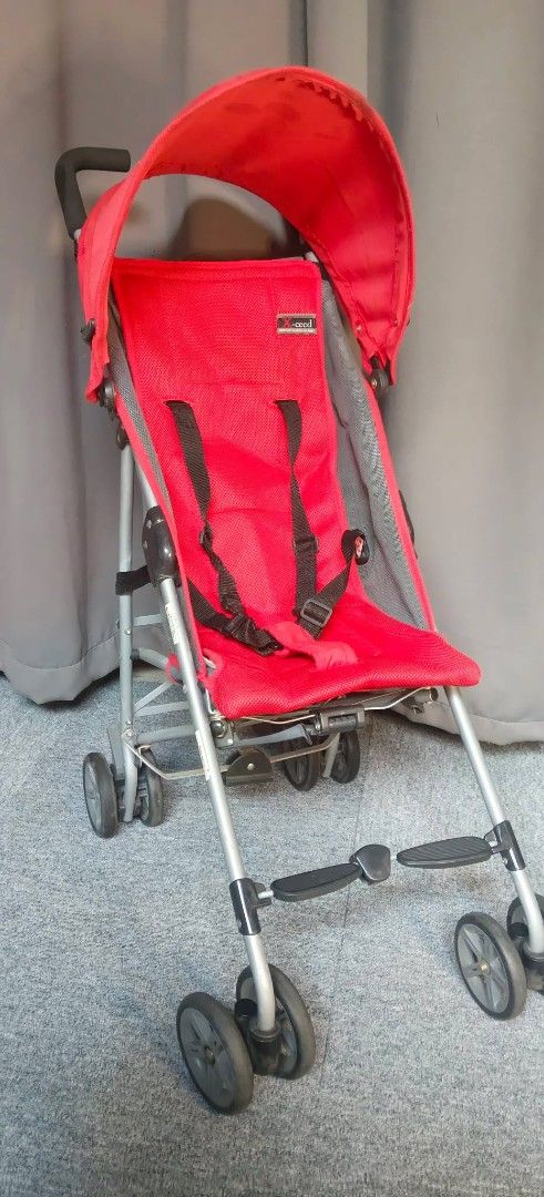 Richell Brand Stroller - Imported from Japan (Category: Strollers) located in Valenzuela. Submitted by gracebacot17959 (Listing ID 1429341801, Image 3). Description: Richell stroller is imported from Japan. It features a red seat with a sunshade and a safety harness. The stroller has a lightweight frame and four sets of wheels. The Richell brand logo is visible on the seat..