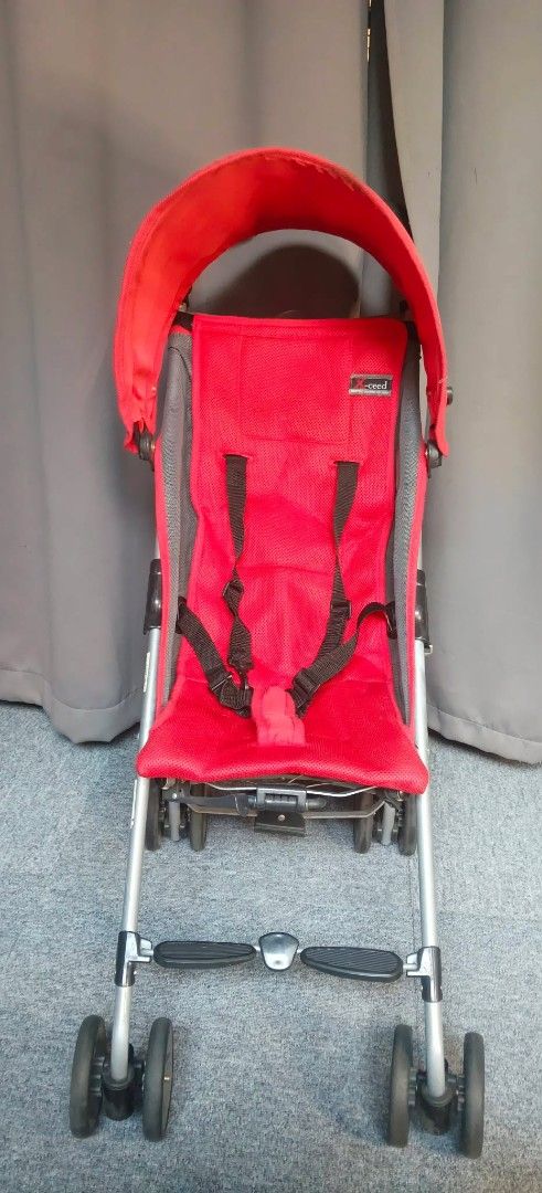 Richell Brand Stroller - Imported from Japan (Category: Strollers) located in Valenzuela. Submitted by gracebacot17959 (Listing ID 1429341801, Image 2). Description: Richell stroller is imported from Japan. It features a red seat with a sunshade and a safety harness. The stroller has a lightweight frame and four sets of wheels. The Richell brand logo is visible on the seat..