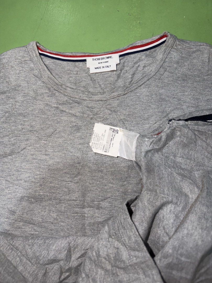 Shirt (Category: Luxury Apparel) located in Pasig City. Submitted by reyeslarry11740 (Listing ID 1429389991, Image 3). Description: For Sale Thom Browne Shirt Pambabae Size 0 fit S-M 17.5w x 22L 23.5L Back Good as new No issue Need wash, see last picture 1500 only Payment 1st Pasig city .