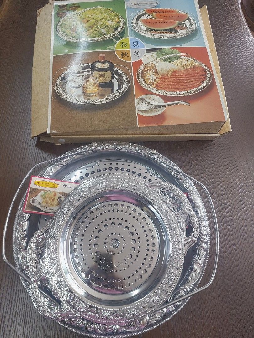 Sunny Rose Serving Tray Set (Category: Other Kitchenware & Tableware) located in Bulacan. Submitted by hnbfinds (Listing ID 1429375876, Image 1). Description: Sunny Rose stainless steel hors d'oeuvre dish set, which typically includes one large serving tray and five smaller individual plates. Product Details Brand/Series: Sunny Rose. Material: Stainless steel with a silver-colored finish. Components: The set in the image consists of a large handl