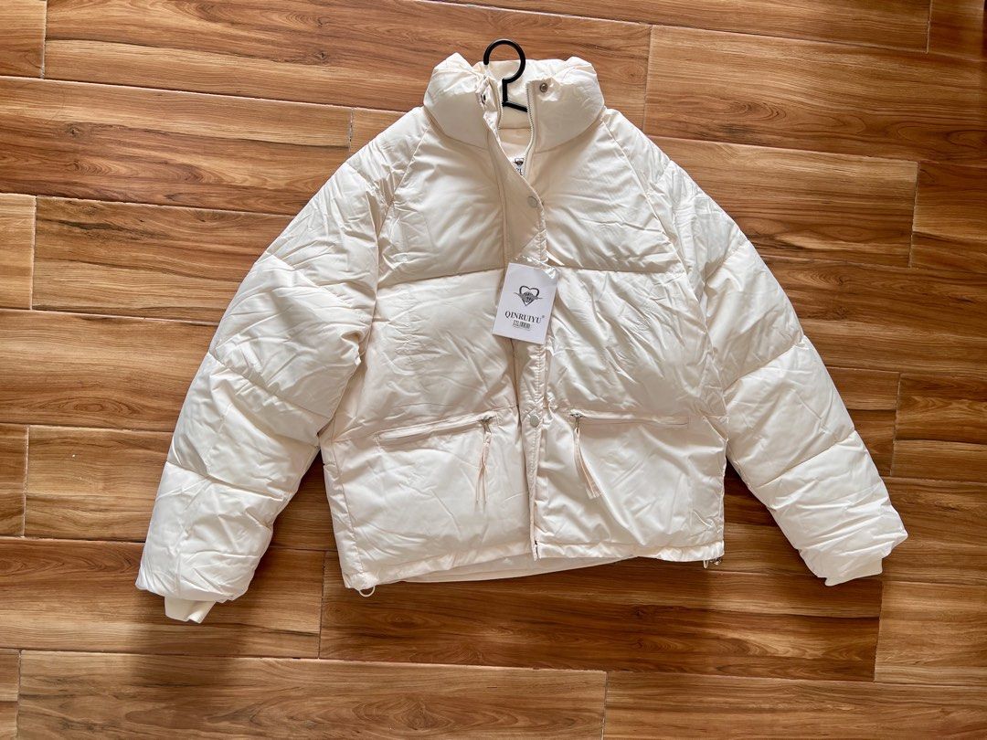 Women's Winter Stand Collar Puffer Jacket (Category: Coats, Jackets and Outerwear) located in Manila. Submitted by xksy1 (Listing ID 1429392171, Image 3). Description: Brand new white puffer jacket!! Perfect for outerwear and layering Received this just March 8 but travel got cancelled. :( pls take it from me 😭 I got it for 698 see screenshot. Size chart in pics as well. Slightly negotiable pls mabawi ko lang nagastos sa nacancel na trip :( .