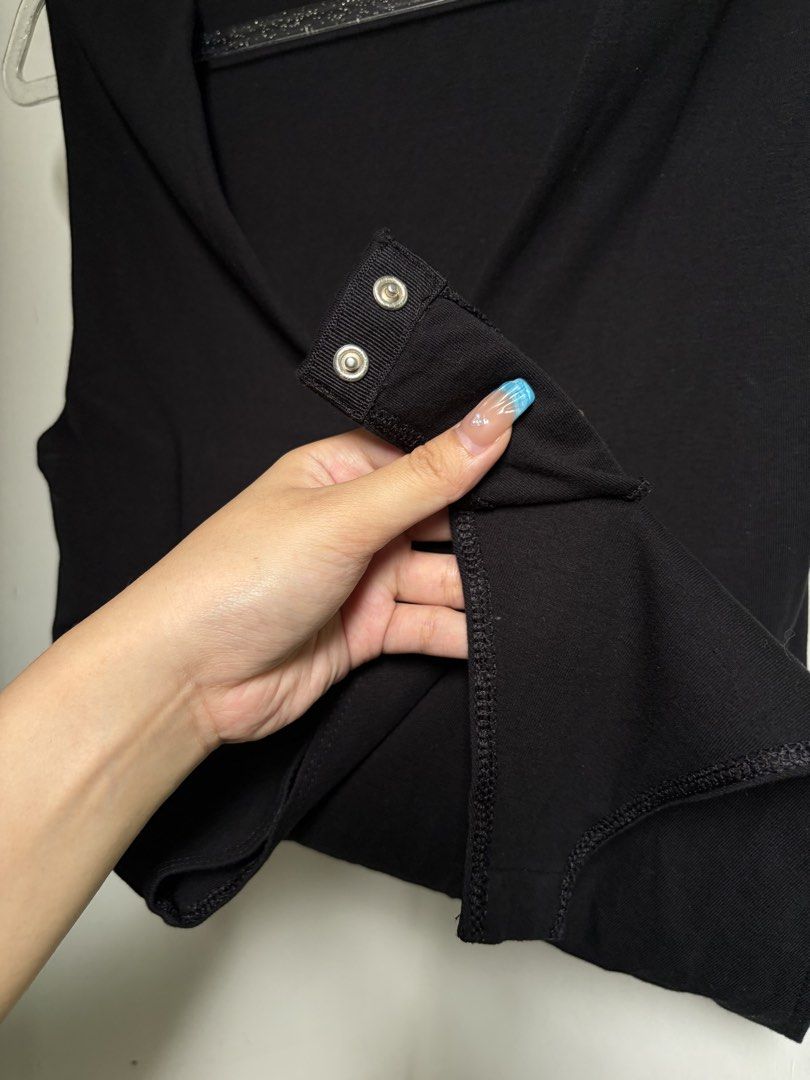Zara Black Sleeveless Bodysuit (Category: Sleeveless) located in Pulilan. Submitted by margaretsedit (Listing ID 1429414928, Image 2). Description: Black sleeveless bodysuit from Zara. Features a V-neck design and snap closure at the bottom. Made of a soft, stretchy fabric. Size M. Perfect for layering or wearing on its own. A versatile piece for any wardrobe. Add 62 for SF.