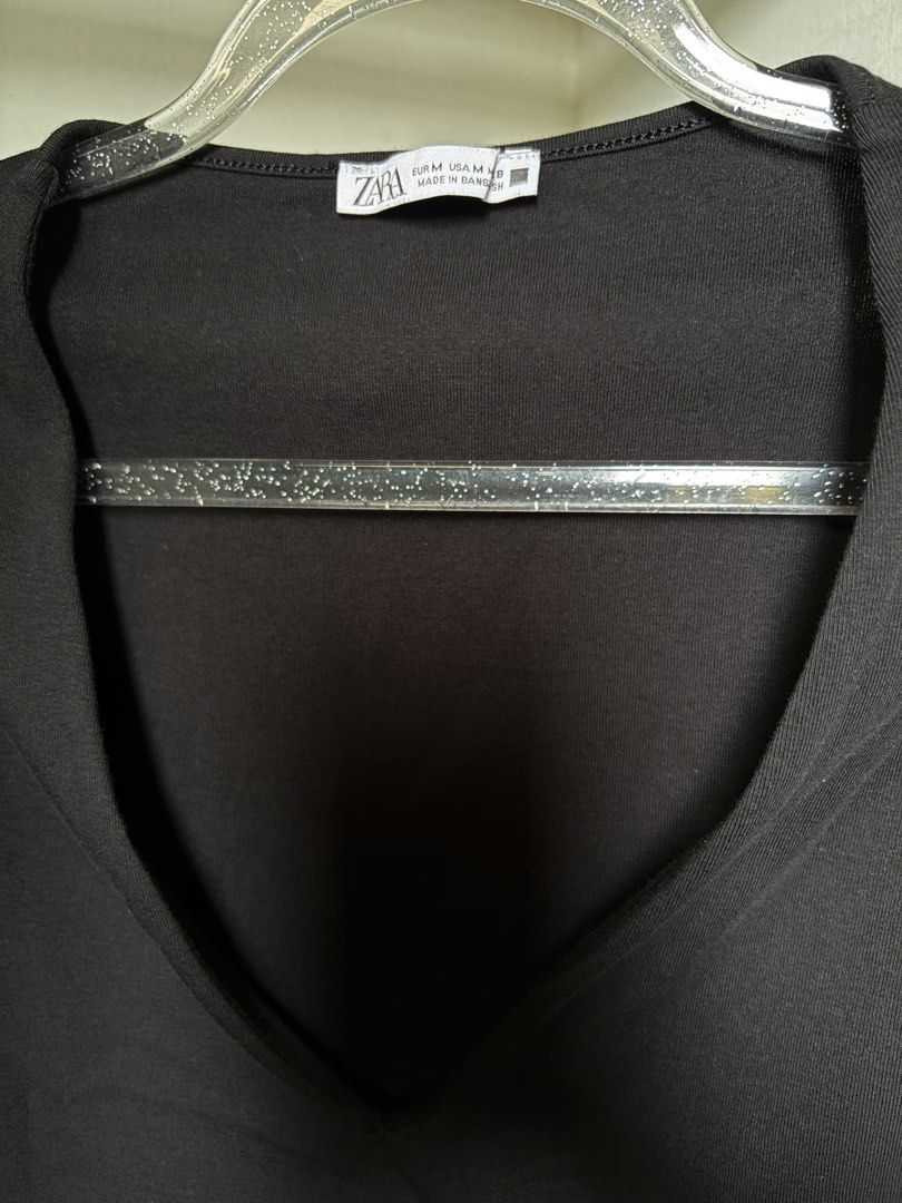 Zara Black Sleeveless Bodysuit (Category: Sleeveless) located in Pulilan. Submitted by margaretsedit (Listing ID 1429414928, Image 3). Description: Black sleeveless bodysuit from Zara. Features a V-neck design and snap closure at the bottom. Made of a soft, stretchy fabric. Size M. Perfect for layering or wearing on its own. A versatile piece for any wardrobe. Add 62 for SF.
