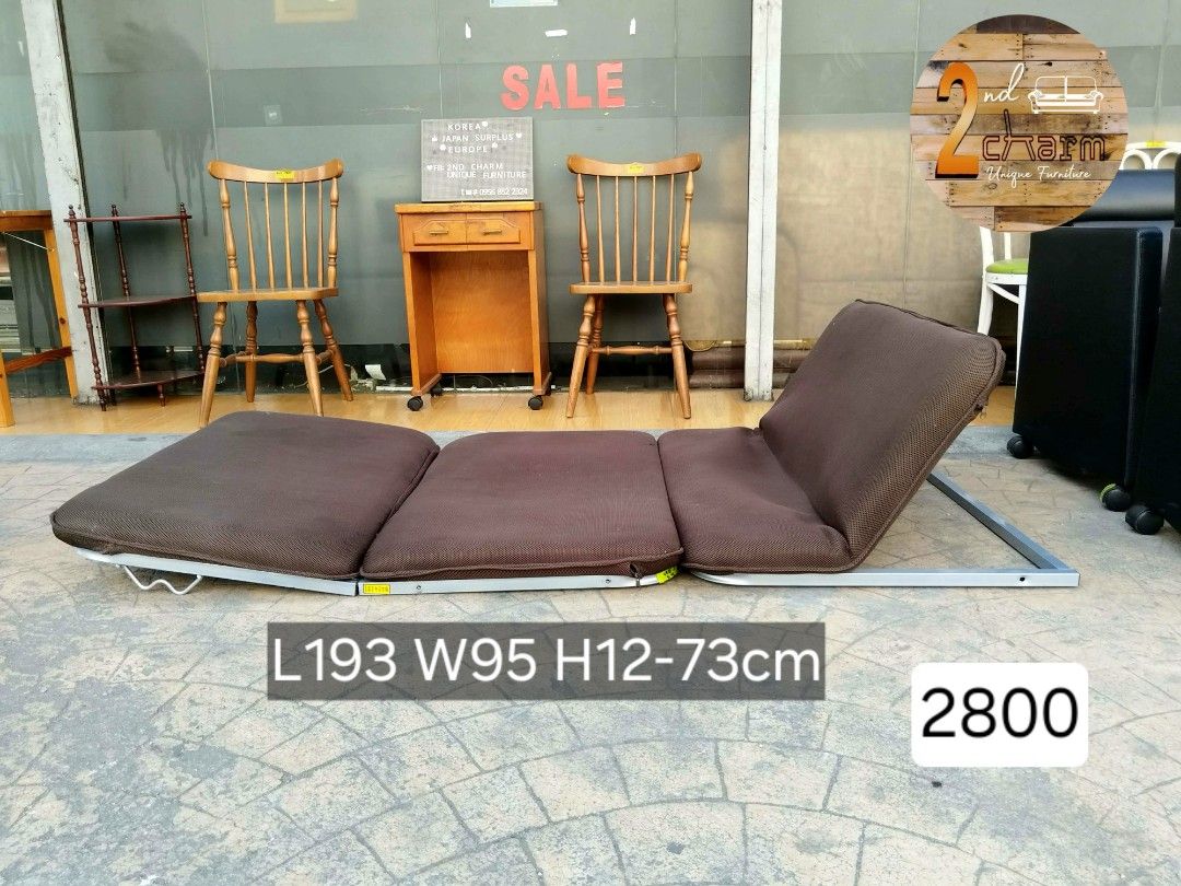 2nd hand Single Low Folding Bed with Brown Fabric (Category: Bed Frames & Mattresses) located in Paranaque City. Submitted by 2ndcharmfurniture (Listing ID 1424642045, Image 2). Description: Folding bed features a brown fabric and a sturdy metal frame. It can be folded for easy storage and transport. Dimensions when folded: L95 W76 H70cm. When unfolded: L193 W95 H12-73cm. It is ideal for small spaces or as an extra bed for guests..