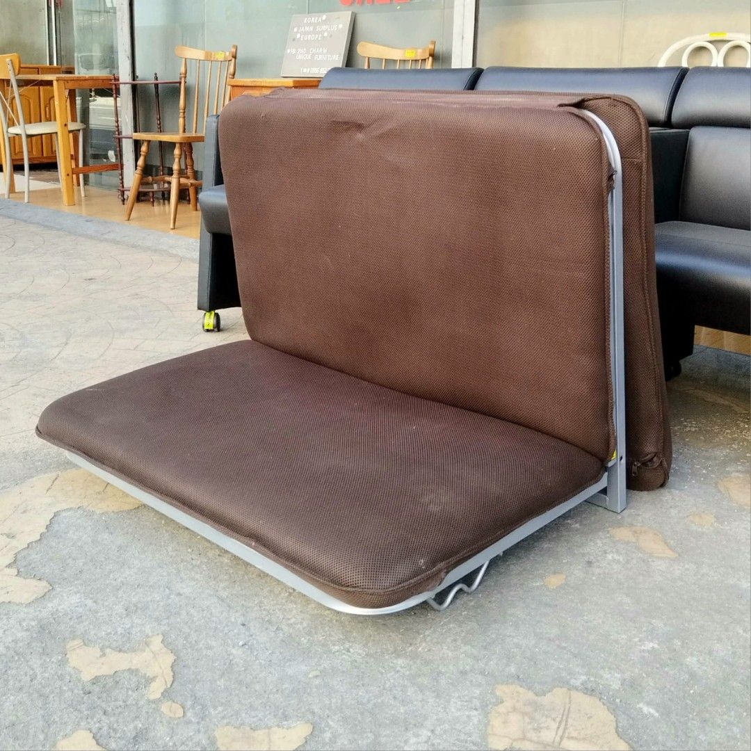 2nd hand Single Low Folding Bed with Brown Fabric (Category: Bed Frames & Mattresses) located in Paranaque City. Submitted by 2ndcharmfurniture (Listing ID 1424642045, Image 3). Description: Folding bed features a brown fabric and a sturdy metal frame. It can be folded for easy storage and transport. Dimensions when folded: L95 W76 H70cm. When unfolded: L193 W95 H12-73cm. It is ideal for small spaces or as an extra bed for guests..