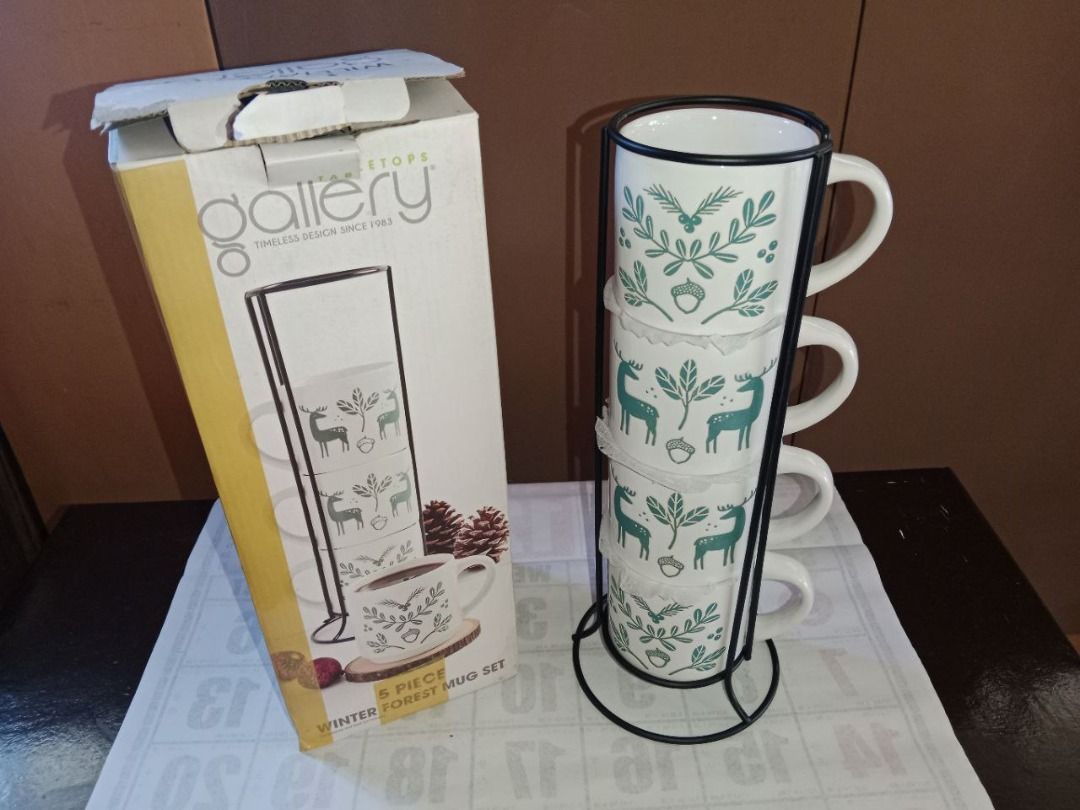 4 coffee mugs with rack, 473 ml each - Gallery Tabletops (Category: Coffee & Tea Tableware) located in Bayambang. Submitted by lucky_faststar_74a229 (Listing ID 1424667057, Image 1). Description: Winter forest mug set 4 mugs ( 473 ml each) 1 rack With box.