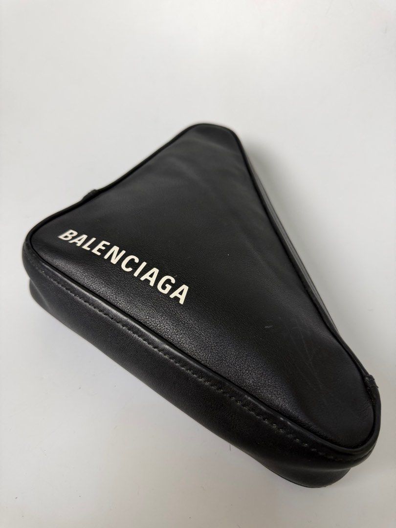 Balenciaga Triangle Clutch (Category: Luxury Bags & Wallets) located in Bayambang. Submitted by aevan143 (Listing ID 1424592808, Image 3). Description: - Balenciaga Triangle Clutch - Black exterior with white Balenciaga logo - Red interior - Interior features Balenciaga logo and serial number - Zip closure - Made in Italy.