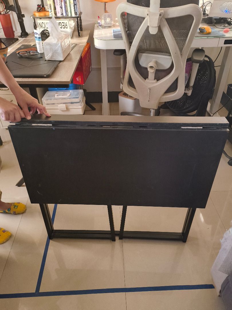 Black Folding Table (Category: Tables & Sets) located in Mandaluyong City. Submitted by delubyoboi (Listing ID 1424702788, Image 2). Description: - Super duper preloved foldable table - Ang ganda pa nya, minus lang sa konting dumi sa table top - Easy storage din Issue: Medyo madumi lang RFS: Not used anymore, but again sobrang ganda pa niya. .