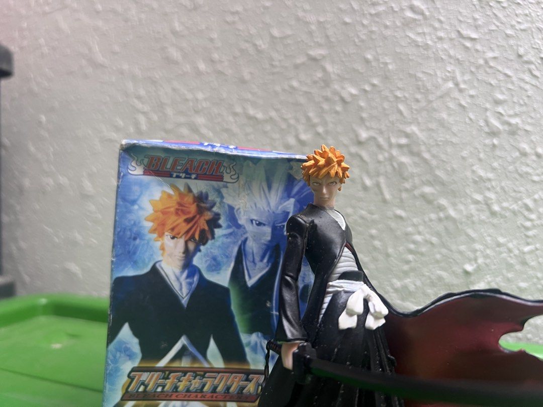 Bleach Ichigo Kurosaki Figure (Category: Figurines & Statues) located in Zamboanga. Submitted by lcomprendio26013 (Listing ID 1424591748, Image 2). Description: - Class A figure only Ichigo Kurosaki figure from Bleach. - Includes original box. - Figure is posed with his sword and cape. - Box features Japanese text and character art. - Figure is displayed on a black hexagonal base. 149 only.