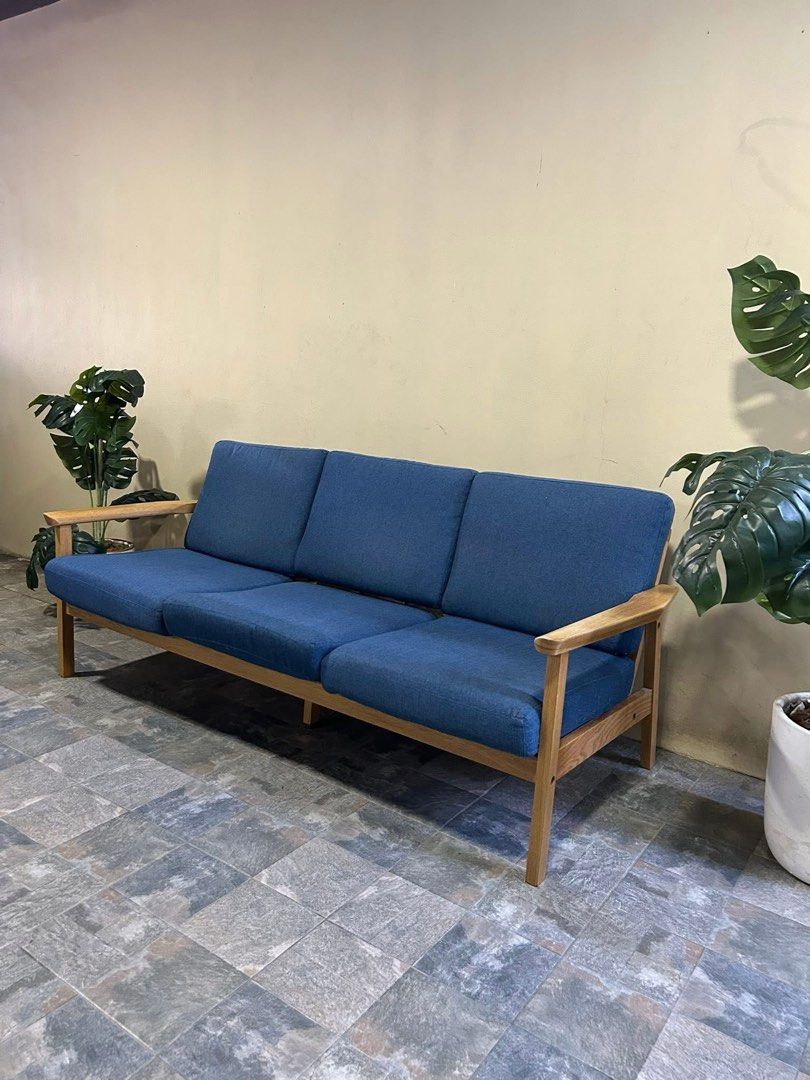 Blue Fabric Sofa with Wooden Frame (Category: Sofas) located in Angeles City. Submitted by honeybowteek23 (Listing ID 1424545152, Image 2). Description: Imported Solid Wood Sofa Washable Cover from Korea P14,500 Only fixed price 70x30x30in Solid Wood Washable Cover Heavy duty No issue Good Condition Minor Scratch From Korea Loc: Angeles City near Pandan Brgy Hall.