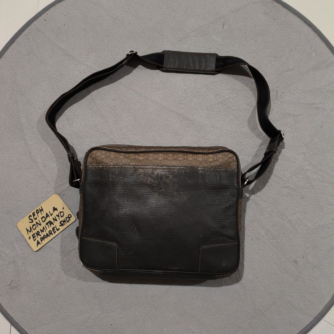 Bruno Magli Messenger Bag (Category: Luxury Bags & Wallets) located in Calatrava. Submitted by ermitany0 (Listing ID 1424661176, Image 2). Description: - Bruno Magli messenger bag - Geometric pattern - Shoulder strap - Zipper closure - Brown and black color scheme - Interior patterned lining - "KUM KANG" tag inside - Made in Korea - width x length: 13.5x10.5 - flaws: fade and scratches - please check photos for more details ✅ location: Negros Occ