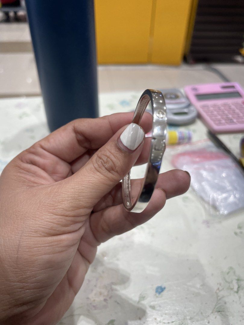 Cartier Love Bracelet (Category: Bracelets) located in Malay. Submitted by thailandcuties (Listing ID 1424624080, Image 2). Description: - Cartier Love Bracelet - Silver-colored bangle - Features the iconic screw head design - A timeless and elegant piece - Perfect for any occasion - A must-have addition to your jewelry collection.