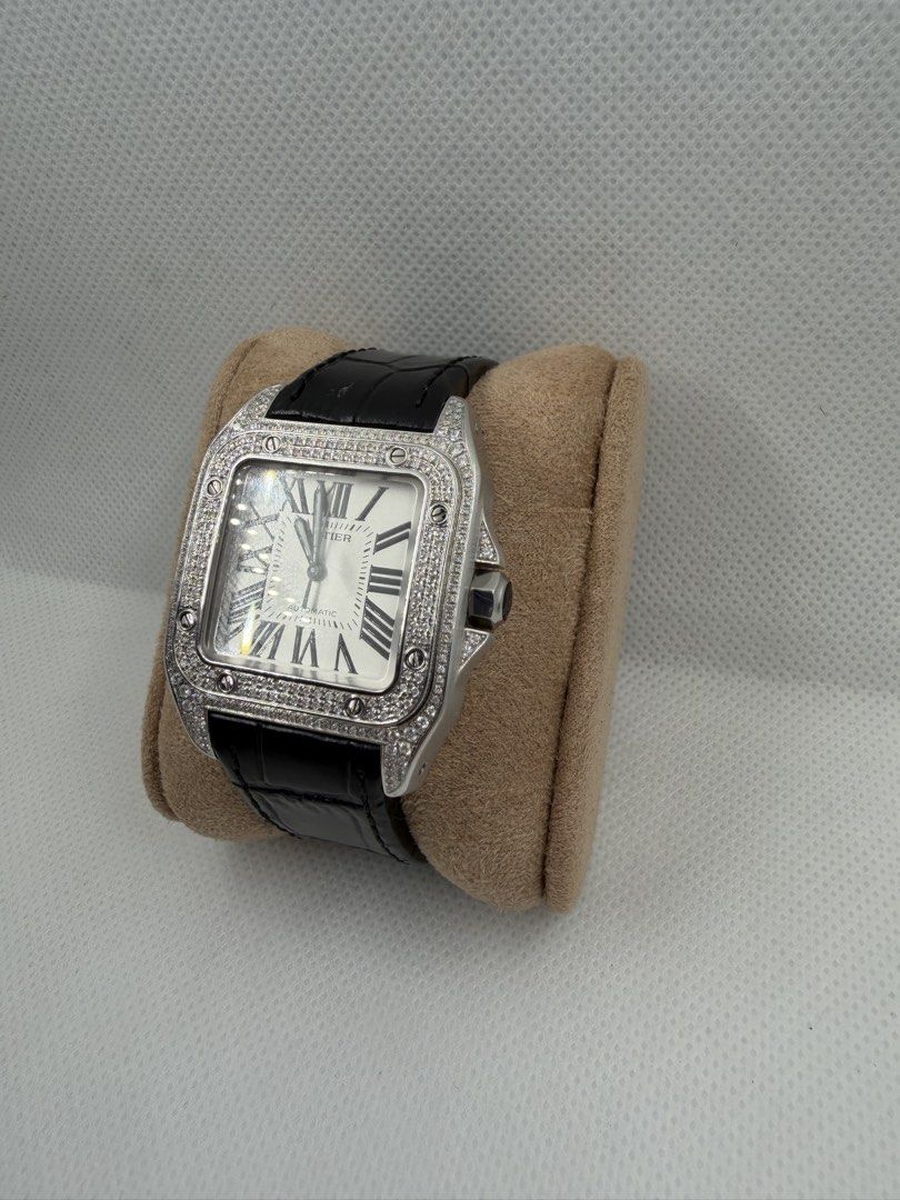 Cartier Santos 100- Medium - Iced Out (Category: Luxury Watches) located in Del Monte. Submitted by antoniomal40766 (Listing ID 1424592216, Image 2). Description: Cartier Santos 100- Medium - Iced Out Movement: Automatic Case material : Ice Out Size: Medium Bracelet material: Leather Condition: 9/10 Comes with: - Box - Paper P295k (negotiable) .