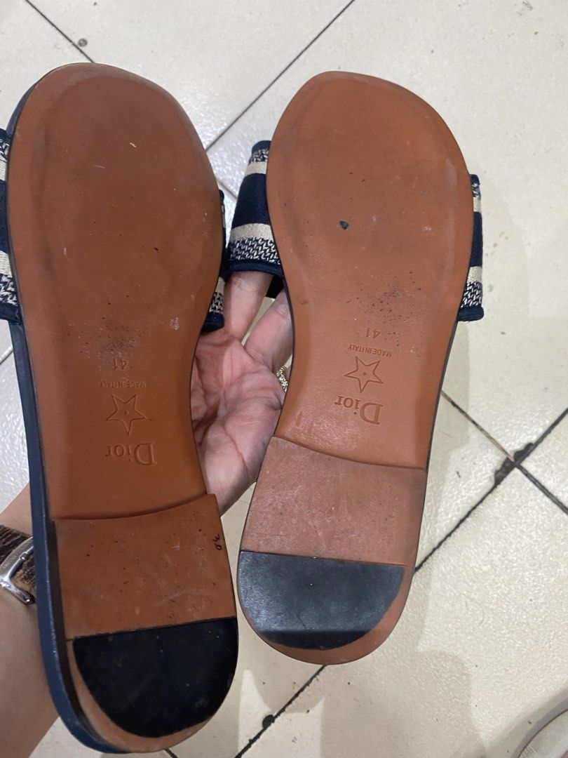 Christian Dior Navy Blue Slides Sandals (Category: Flats & Sandals) located in Cebu City. Submitted by simpleabundance (Listing ID 1424576798, Image 2). Description: - Authentic Christian Dior slides - Navy blue color - Size 41 - Features the iconic Christian Dior logo - Made in Italy - Insole 27cm.