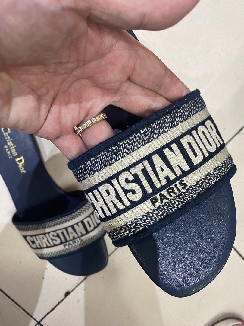 Christian Dior Navy Blue Slides Sandals (Category: Flats & Sandals) located in Cebu City. Submitted by simpleabundance (Listing ID 1424576798, Image 3). Description: - Authentic Christian Dior slides - Navy blue color - Size 41 - Features the iconic Christian Dior logo - Made in Italy - Insole 27cm.