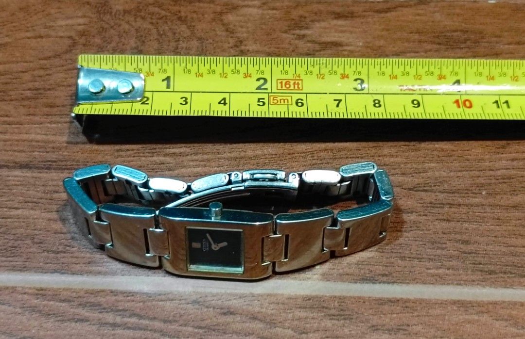Citizen Quartz Watch 5920-S93584 (Category: Women's Watches) located in Manila. Submitted by welbern (Listing ID 1424556228, Image 3). Description: Citizen quartz watch with a square black dial. The watch has a silver-colored metal band and case. The back of the watch indicates it is water-resistant and has the model number 5920-S93584. The watch is marked as "MVT JAPAN"..