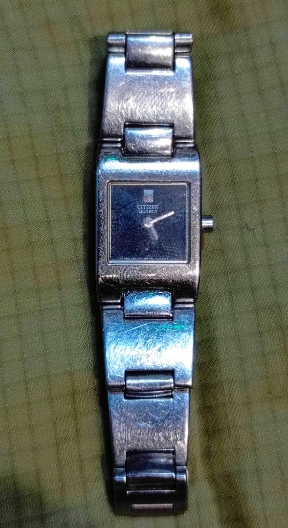 Citizen Quartz Watch 5920-S93584 (Category: Women's Watches) located in Manila. Submitted by welbern (Listing ID 1424556228, Image 1). Description: Citizen quartz watch with a square black dial. The watch has a silver-colored metal band and case. The back of the watch indicates it is water-resistant and has the model number 5920-S93584. The watch is marked as "MVT JAPAN"..
