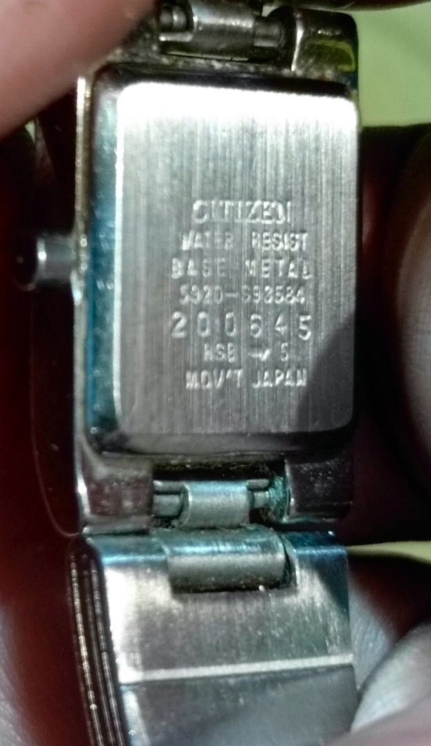 Citizen Quartz Watch 5920-S93584 (Category: Women's Watches) located in Manila. Submitted by welbern (Listing ID 1424556228, Image 2). Description: Citizen quartz watch with a square black dial. The watch has a silver-colored metal band and case. The back of the watch indicates it is water-resistant and has the model number 5920-S93584. The watch is marked as "MVT JAPAN"..