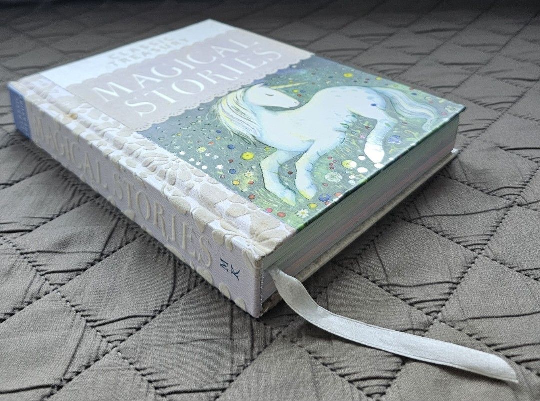 Classic Treasury Magical Stories Book (Category: Children's Books) located in Quezon City. Submitted by the_l1ttlej0ys (Listing ID 1424551385, Image 3). Description: preloved Classic Treasury Magical Stories book hardbound decoration on outside spine has felt cloth consistency thick glossy paper for inside pages vibrant illustrations condition like new with occasional storage marks.