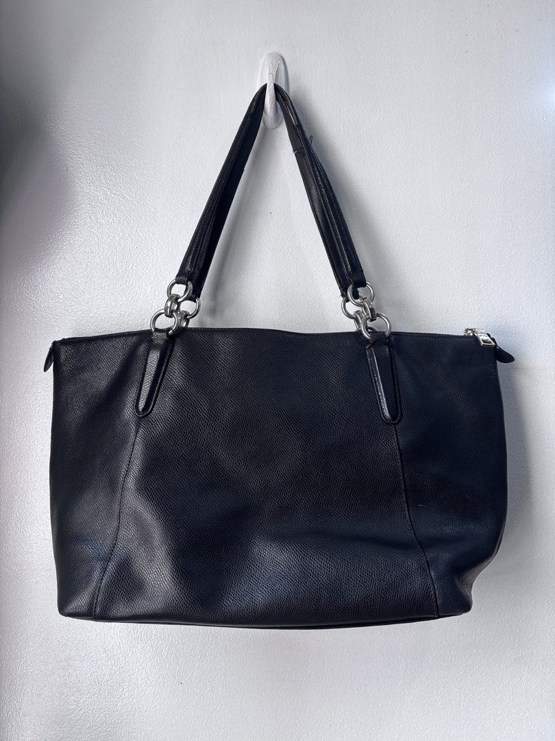 Coach Ava Black Leather Tote Bag (Category: Luxury Bags & Wallets) located in Pasay City. Submitted by letherdeclutter (Listing ID 1424596553, Image 2). Description: Price is negotiable With Free Felt Organizer 🧚🏼🧚🏼 Fits 13 inch Laptop Flaws : Leather on the handle is cracking, scuffs on the edges at the bottom part of the bag, but barely noticeable. .