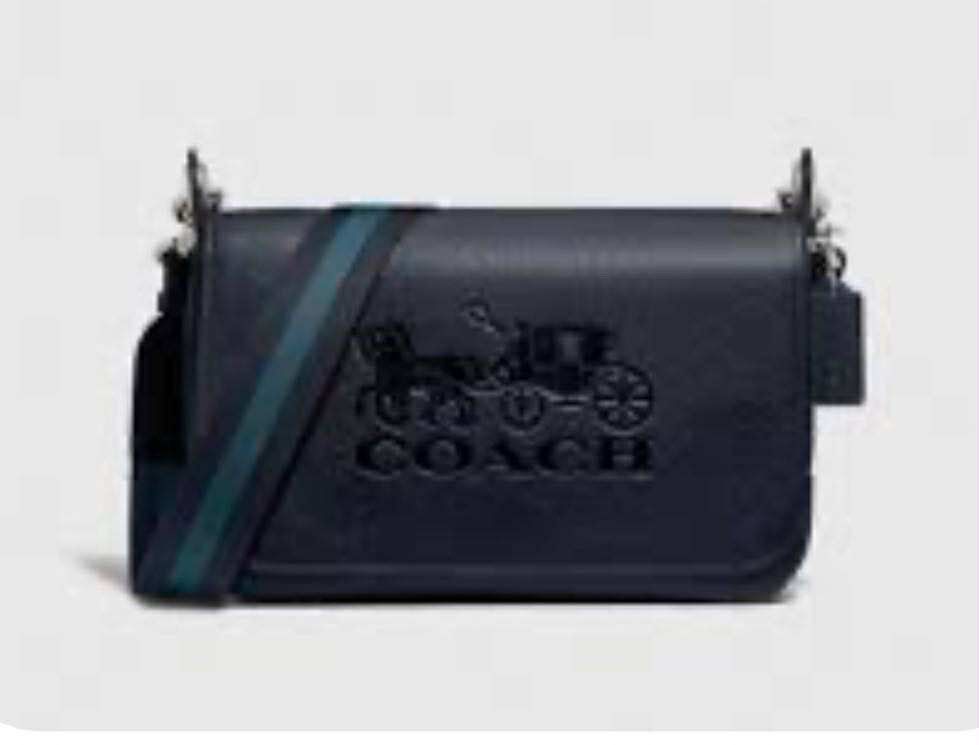 Coach Black Leather Shoulder Bag (Category: Luxury Bags & Wallets) located in Pasay City. Submitted by shengrodanilla (Listing ID 1424625700, Image 1). Description: - Authentic Coach shoulder bag - Flap closure - Embossed Coach logo - Detachable and adjustable shoulder strap - Gold-tone hardware with silver stripe - Made of leather.