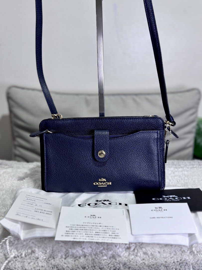 Coach Navy Blue Crossbody Bag (Category: Luxury Bags & Wallets) located in Caloocan City. Submitted by nuoph (Listing ID 1424647663, Image 1). Description: Coach Purchased sa Japan Slightly used SRP 10k+ Selling for only 4,400 FREE acrylic bag case.