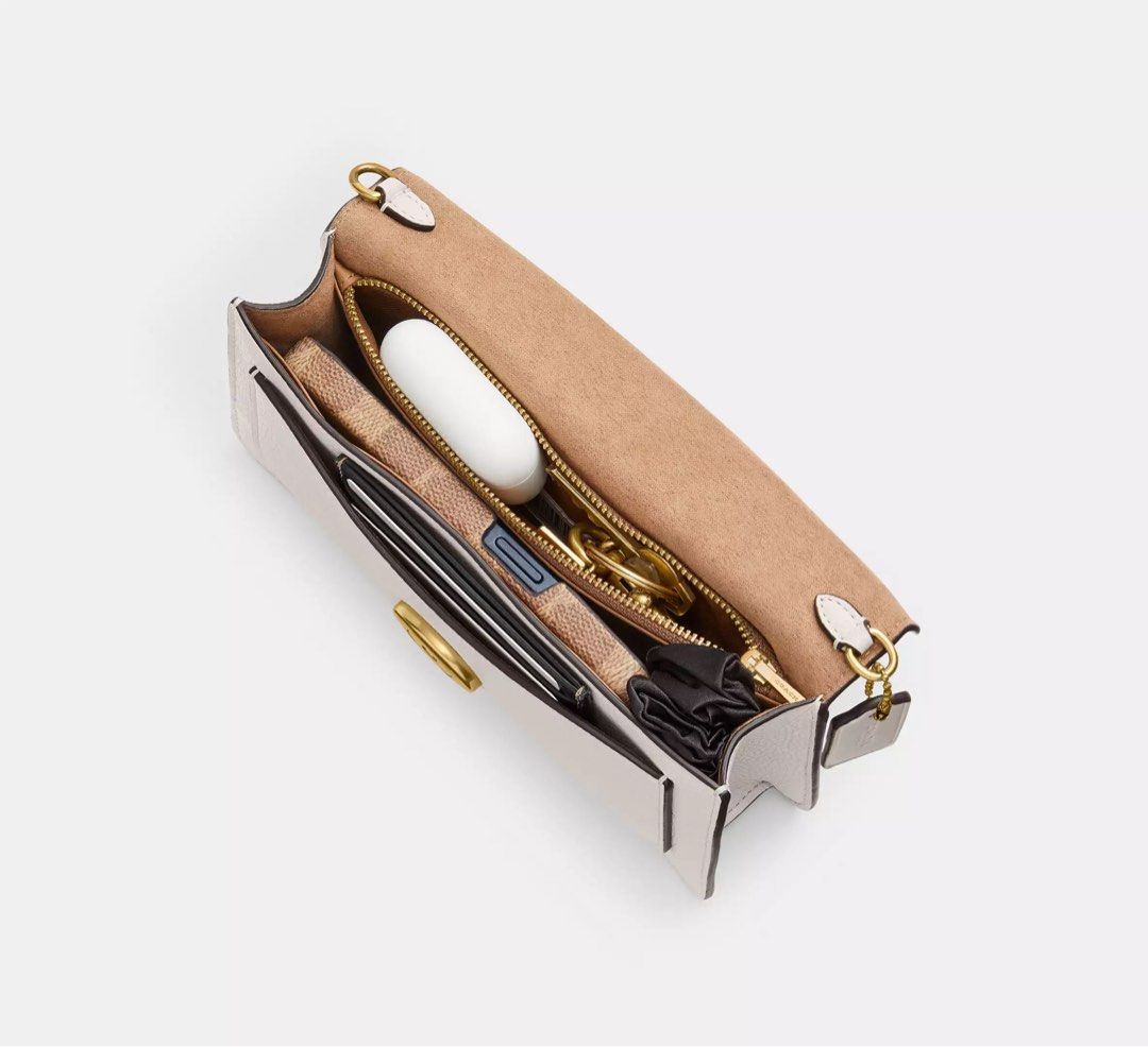 COACH Tabby Chain Clutch (Category: Luxury Bags & Wallets) located in Quezon City. Submitted by xo.cart (Listing ID 1424522912, Image 2). Description: 🍁 PASABUY / PRE-ORDER 🍁 🇨🇦 sourced 🛍️ COACH outlet 💯 authentic 🛒 layaway accepted (+2.5%) available color/s: • Brass/Chalk • Silver/Black • Brass/Black ETA: April 5, 2026.