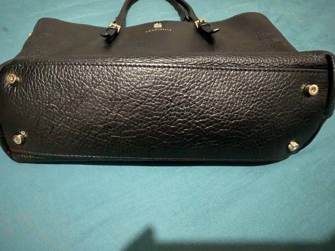 Coccinelle tote bag (Category: Luxury Bags & Wallets) located in Muntinlupa City. Submitted by nixie_go (Listing ID 1424670442, Image 2). Description: Elegant and authentic Coccinelle black leather tote bag, purchased online and used only a few times. Color: Black Material: Genuine pebbled leather Condition: Gently used, excellent condition Features: Gold-tone hardware, spacious interior, sturdy straps Authenticity: With original brand code Origi