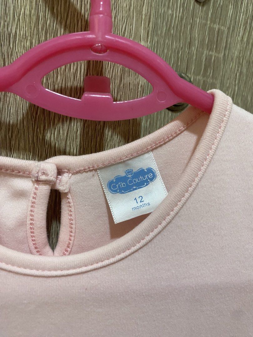 Crib Couture Ruffle Dress - 12 Months (Category: Babies & Kids Fashion) located in San Pedro. Submitted by cris1923 (Listing ID 1424633907, Image 2). Description: - Crib Couture dress for 12-month-old baby. - Sleeveless design. - Round neckline. - Light pink bodice. - Multi-colored ruffle skirt (pink, blue, purple)..