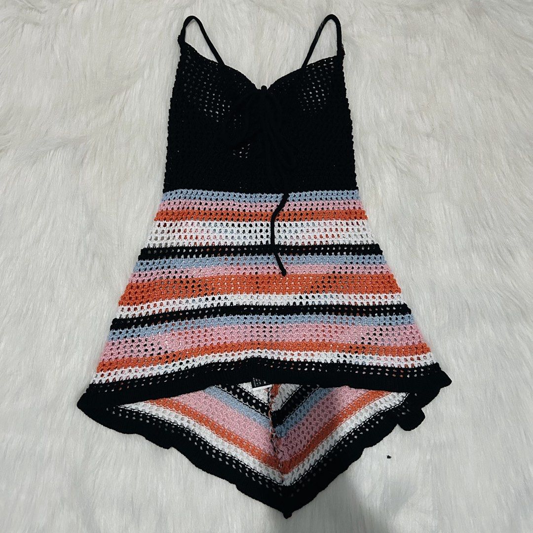 Crochet Cover up Top with Adjustable Tie (Category: Sleeveless) located in Cebu City. Submitted by brandsandtags2 (Listing ID 1424625057, Image 1). Description: - Handmade crochet top - Fits XS-S - Black top with colorful striped bottom - Adjustable spaghetti straps - Tie detail at the front - Breathable, open-weave crochet fabric - Perfect for warm weather.