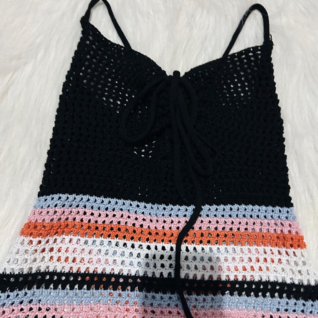 Crochet Cover up Top with Adjustable Tie (Category: Sleeveless) located in Cebu City. Submitted by brandsandtags2 (Listing ID 1424625057, Image 2). Description: - Handmade crochet top - Fits XS-S - Black top with colorful striped bottom - Adjustable spaghetti straps - Tie detail at the front - Breathable, open-weave crochet fabric - Perfect for warm weather.