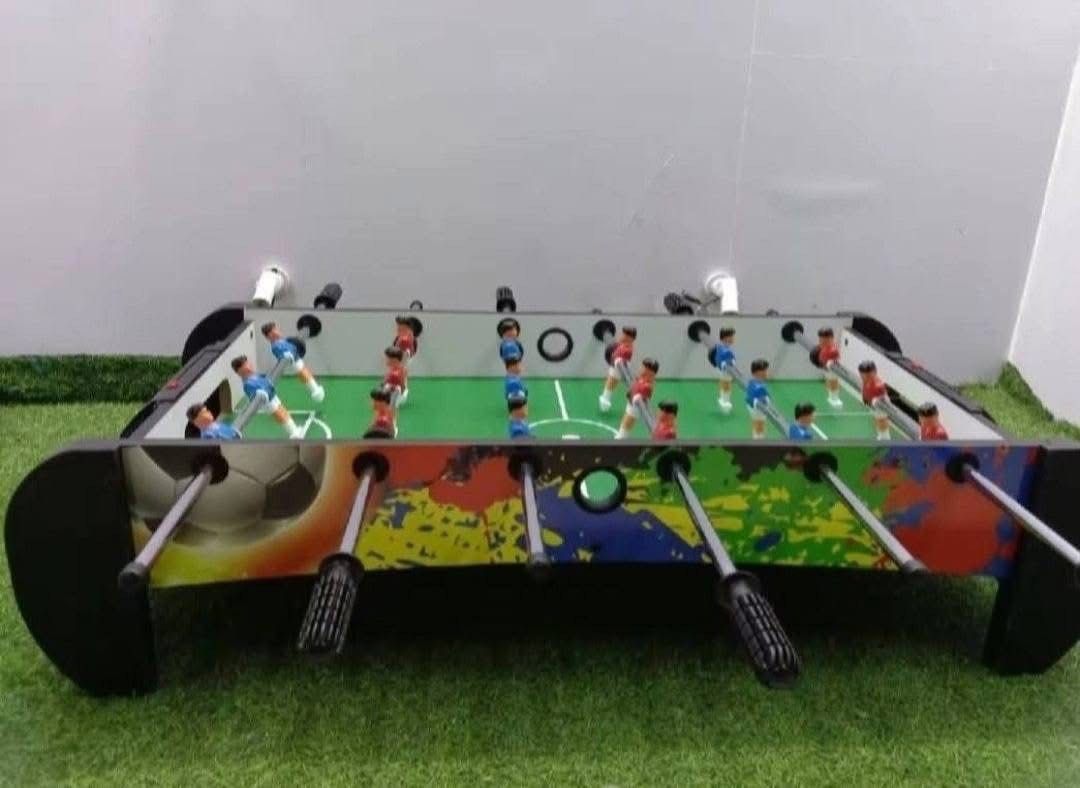 Foosball Table - Colorful Design (Category: Board Games & Puzzles) located in San Pablo. Submitted by vennisa.sportssupplies (Listing ID 1424596080, Image 1). Description: - Vibrant foosball table with a colorful design. - Features red and blue player uniforms. - Includes a green playing surface. - Equipped with a convenient ball return system. - Comes with black handles. - Sturdy base for stability. - Perfect for fun with friends and family..
