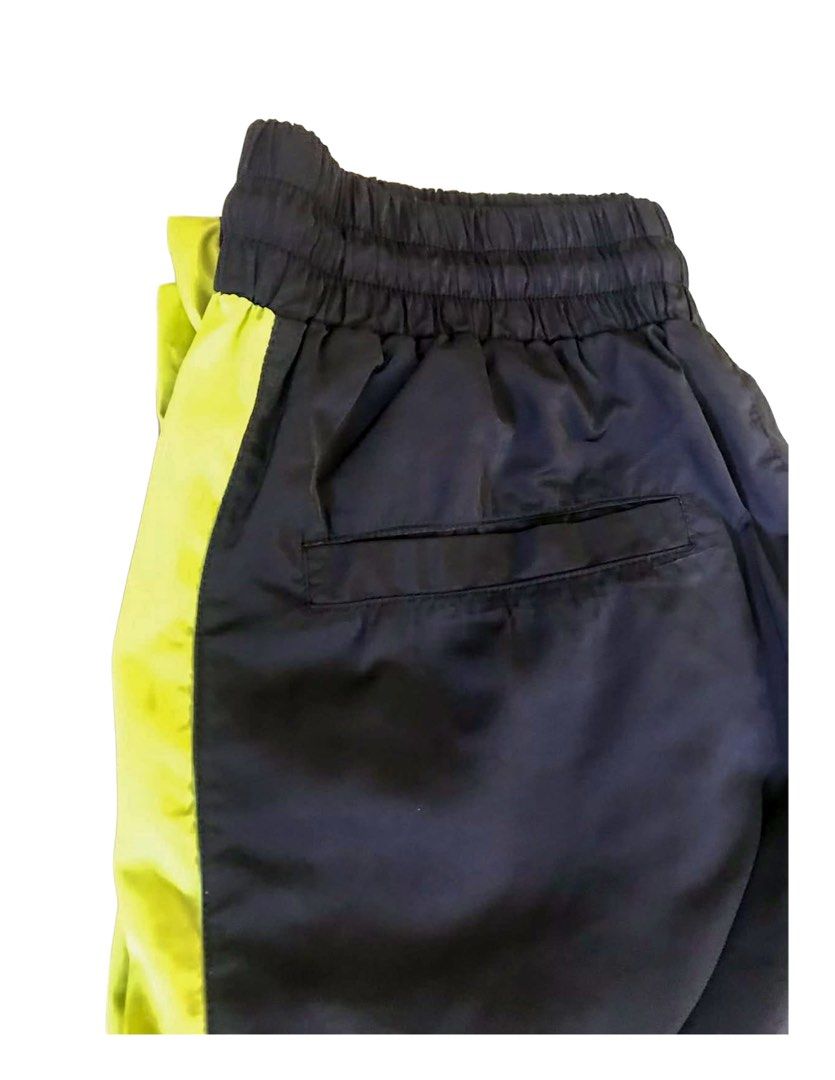 Forever 21 Men Track Pants (Category: Joggers) located in Makati City. Submitted by things77 (Listing ID 1424563665, Image 2). Description: - Black track pants - Neon green side stripes - Elastic waistband - Single back pocket - Brand: Forever 21 Men W: 30 inches H: 37 inches.