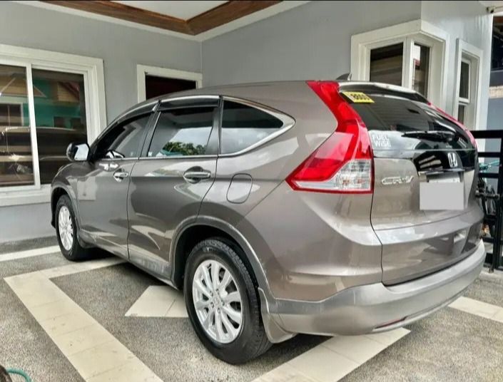 Honda CR-V 2.0 (A) (Category: Used Cars) located in Taguig. Submitted by almamejia86577 (Listing ID 1424698884, Image 2). Description: For sale 2015 Honda CR-V 2.0S A/T Gas Urban Titanium M. (Brownish) With ECON mode Registered until October 2026 Plate no. Ending 0 (Friday coding) 90k mileage 2 keys with remote Original paint RFID installed Open Deed of Sale Issue: May kaldag minsan Selling for 499k slightly negotiable upon viewing. For direct bu