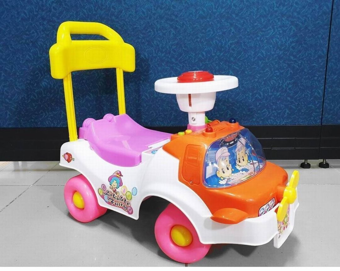 Kids Ride-on Car (Category: Kids Toys) located in Caloocan City. Submitted by wattafindp97985 (Listing ID 1424542199, Image 1). Description: - Ride-on car designed for toddlers - Includes steering wheel, push handle, and seat - Features a fun design with cartoon characters - Eye-catching color scheme: pink and yellow wheels, white and orange body - Ideal for playtime fun.