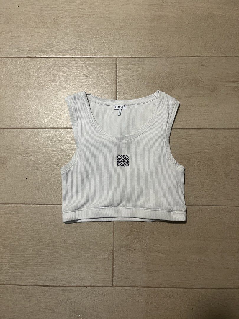 Loewe Ribbed Crop Tank Top (Category: Sleeveless) located in Makati City. Submitted by sixelaa (Listing ID 1424640748, Image 1). Description: - Loewe white ribbed crop tank top - Features embroidered Loewe logo - with back panel - Sleeveless design - Round neckline - Perfect for casual wear - authentic Size M on tag, but fits small and under.