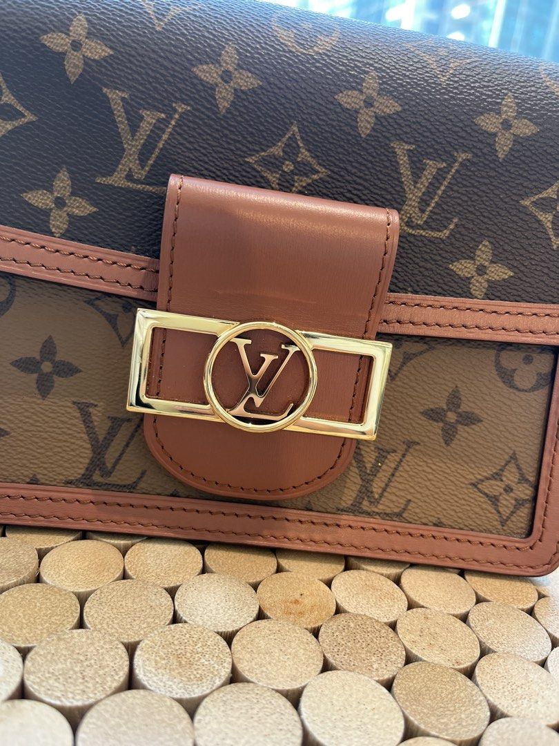 Louis Vuitton Dauphine Mini Bag (Category: Luxury Bags & Wallets) located in Taguig. Submitted by raraofpursemaison (Listing ID 1424574294, Image 2). Description: The classic LV dauphine in Mini size 9/10 condition with hairline scratches on the hardware and white mark under the flap. Inclusions: box, dust bag, detachable strap, material card, ribbon and Entrupy certificate.