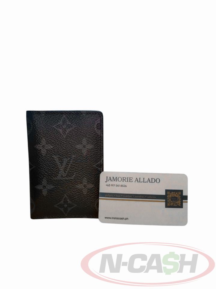Louis Vuitton Monogram Eclipse Pocket Organizer (Category: Luxury Bags & Wallets) located in Makati City. Submitted by luxury_by_ncash_2 (Listing ID 1424565372, Image 1). Description: N-Cash Pawnshop "Instant Cash for Bags, Watches, Cars, and Electronics" https://www.ncash-pawnshop-philippines.com/ Louis Vuitton Monogram Eclipse Pocket Organizer 2020 PRE-OWNED Brand: LOUIS VUITTON Measures: 7.5 x 11 x 1 cm (approx) 9.3/10 Condition Coated Canvas 