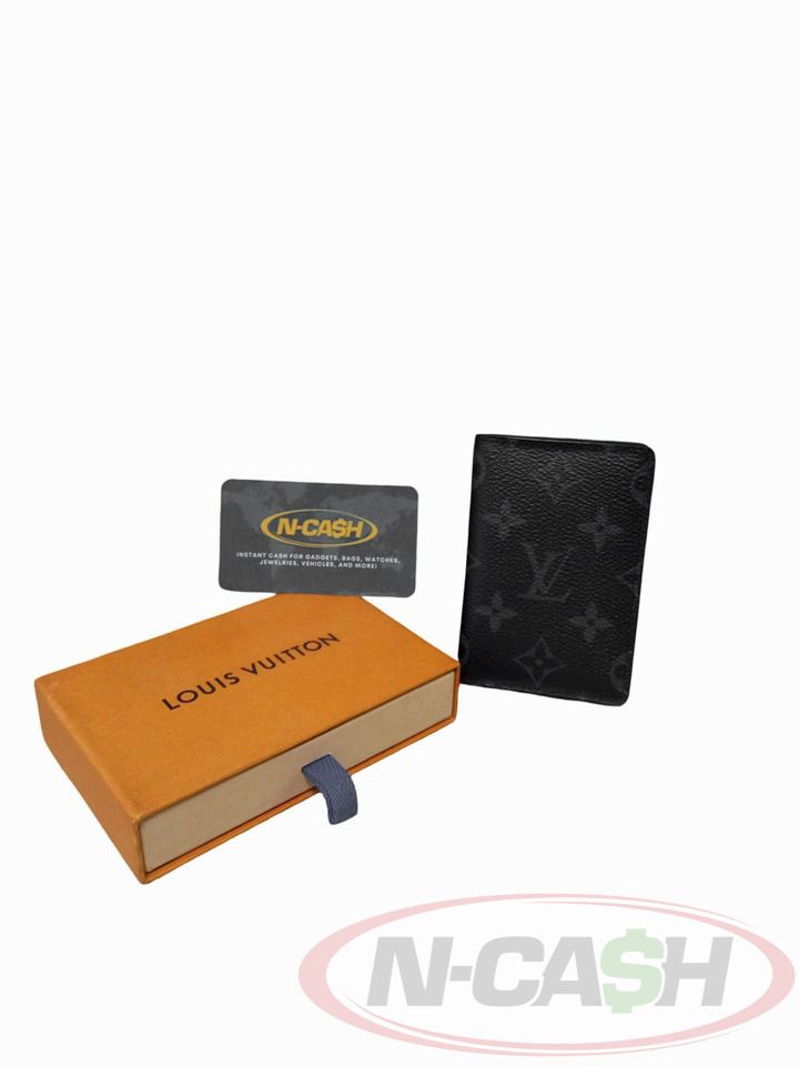 Louis Vuitton Monogram Eclipse Pocket Organizer (Category: Luxury Bags & Wallets) located in Makati City. Submitted by luxury_by_ncash_2 (Listing ID 1424565372, Image 3). Description: N-Cash Pawnshop "Instant Cash for Bags, Watches, Cars, and Electronics" https://www.ncash-pawnshop-philippines.com/ Louis Vuitton Monogram Eclipse Pocket Organizer 2020 PRE-OWNED Brand: LOUIS VUITTON Measures: 7.5 x 11 x 1 cm (approx) 9.3/10 Condition Coated Canvas 