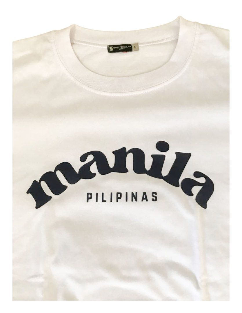 Manila Pilipinas T-shirt (Category: Tshirts & Polo Shirts ) located in Makati City. Submitted by things77 (Listing ID 1424563304, Image 3). Description: - White T-shirt - Features "Manila" arched across the chest with "Pilipinas" below. - Crew neck and short sleeves. - Size: L W: 20 inches H: 26 inches.