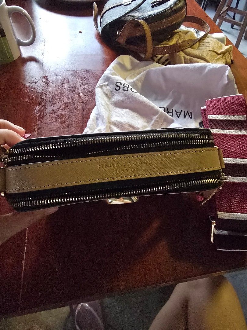 Marc Jacobs The Box Bag (Category: Luxury Bags & Wallets) located in Marikina City. Submitted by any.prelvd (Listing ID 1424531194, Image 2). Description: - Authentic Marc Jacobs The Box Bag - Blush pink leather exterior - Gold-tone logo and zipper - Detachable striped strap - Includes dust bag - Perfect for everyday or special occasions.