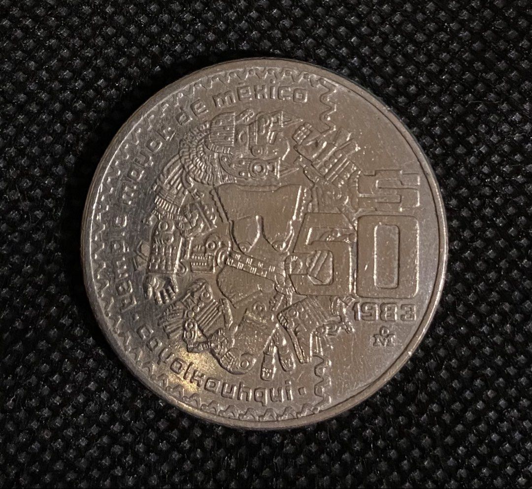Mexican 50 Pesos Coin 1983 (Category: Currency) located in Las Pinas. Submitted by coins_of_the_world (Listing ID 1424562035, Image 1). Description: Commemorative 50 Pesos Mexican coin depicting the Aztec moon goddess Coyolxauhqui, minted between 1982 and 1984. Included PHP10 in the third photo for size comparison..