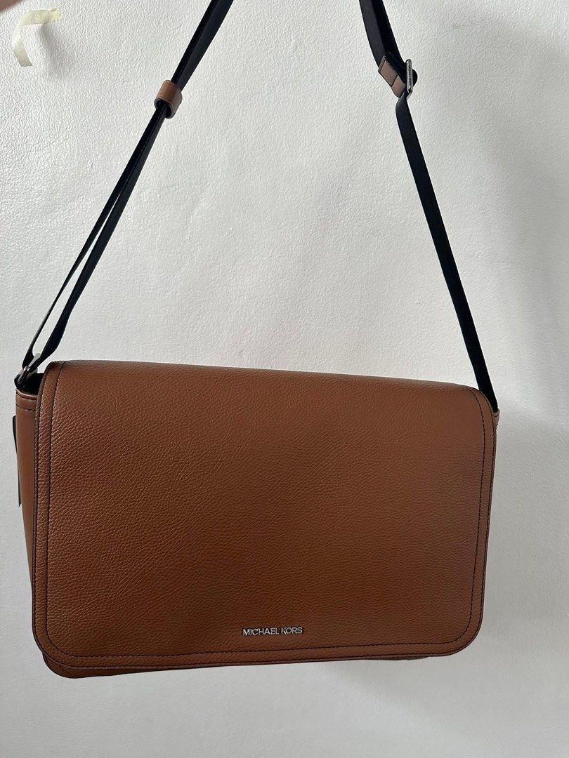 Michael Kors Messenger Bag (Category: Luxury Bags & Wallets) located in Las Pinas. Submitted by UNQUARANTINED (Listing ID 1424597484, Image 1). Description: - Michael Kors messenger bag - Brown leather exterior - Flap closure - Adjustable black strap - Michael Kors logo detail - Perfect for everyday use.