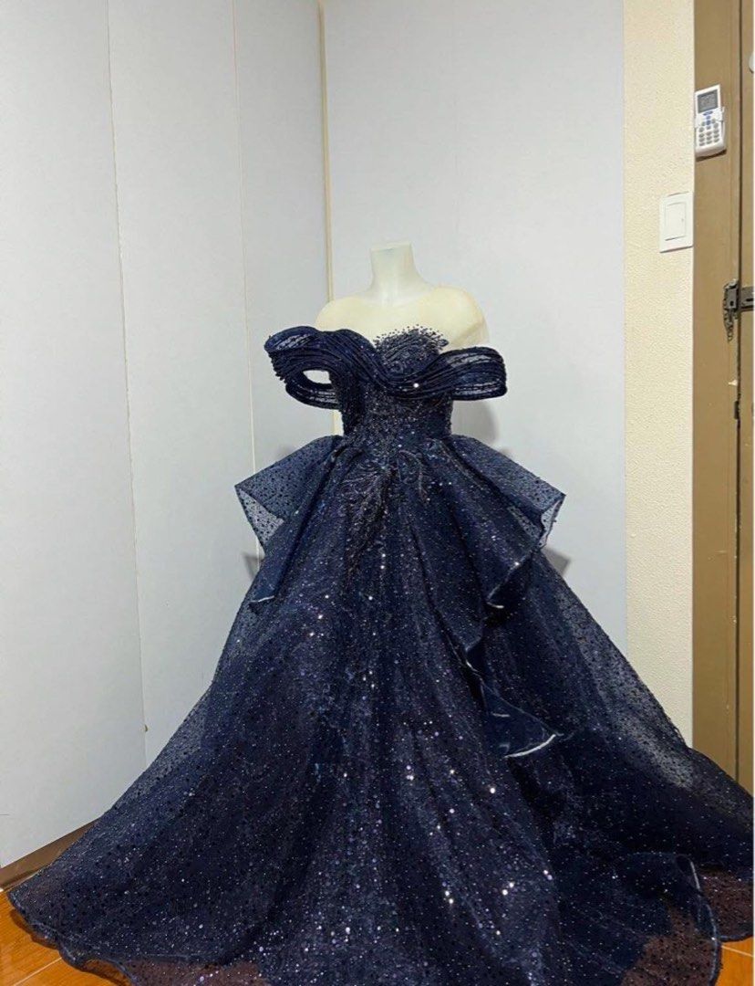 Navy Blue Off-Shoulder Gown (Category: Evening dresses & gowns) located in Manila. Submitted by ragssurplus (Listing ID 1424655969, Image 2). Description: FOR RENT 2k ONLY SECURITY DEPOSIT OF 1k REFUNDABLE ONCE RETURNED WITH NO DAMAGE - Elegant navy blue off-shoulder gown - Sparkling bodice - Layered skirt - Unique design with ruffled sleeves - Detailed neckline - Floor-length with semi long back - Flowing silhouette - Perfect for special occasio